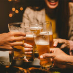 Friends toasting with beer