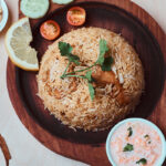 Traditional Kozhikode biriyani with cashews and fresh garnish