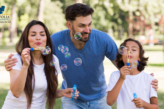 Parents and child enjoying bubble play during hotel activities
