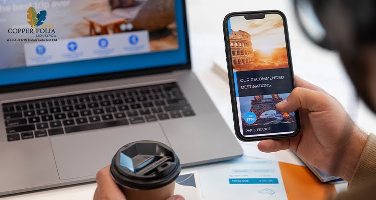 Traveler booking a hotel online using laptop and smartphone