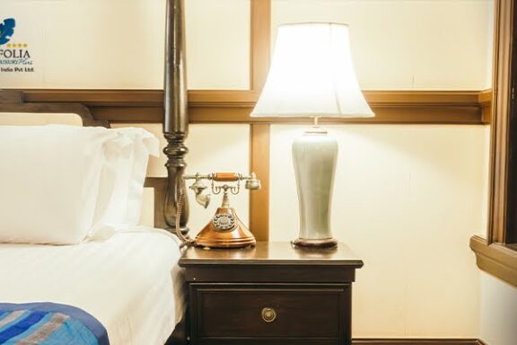 Premium hotel room with soft pillows neat bed and warm lamp