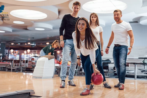 Friends enjoying a fun bowling activity during leisure time