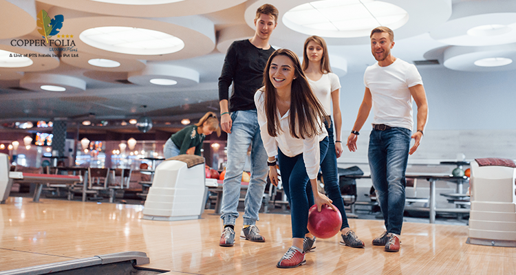 Friends enjoying a fun bowling activity during leisure time